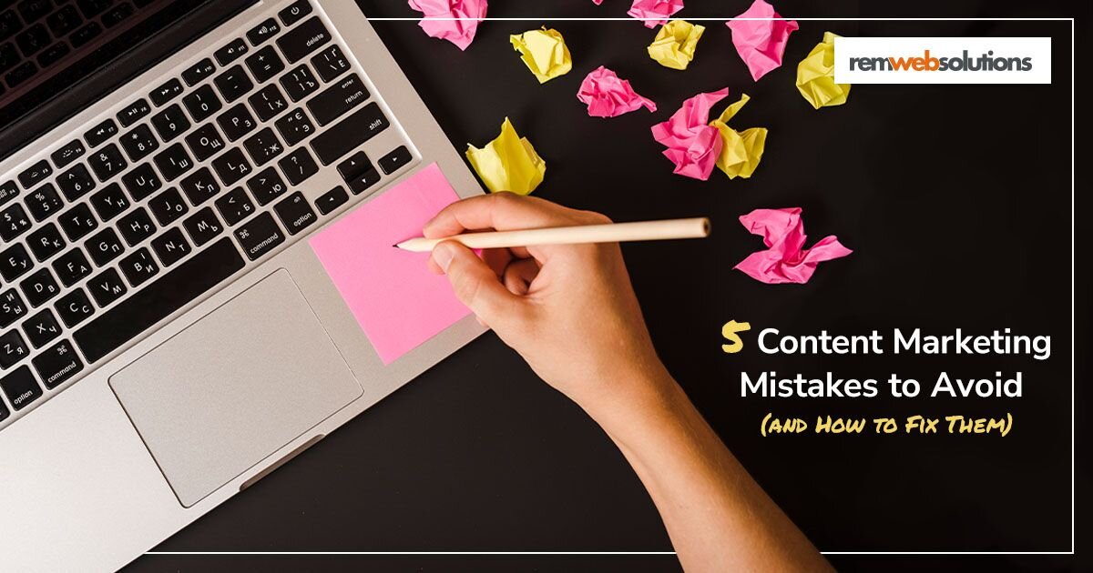 Hand writing on a pink sticky note on laptop. 